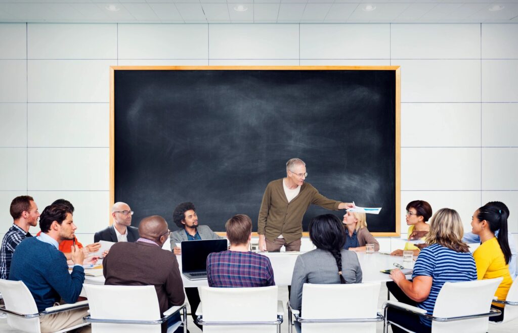 seminar - man facilitating a group of people